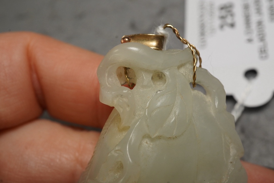 A Chinese pale celadon jade twin gourd pendant, 18th century